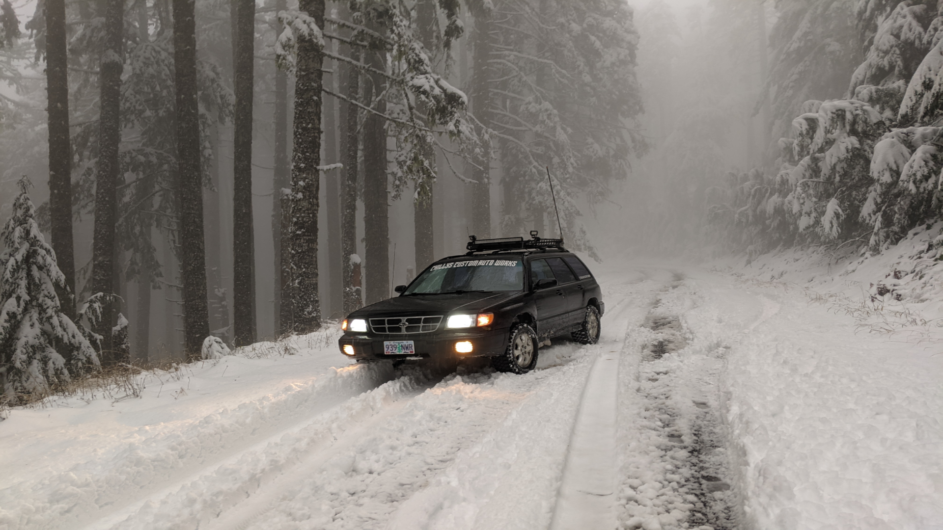Landing Page Background - A Subaru in a snowy setting